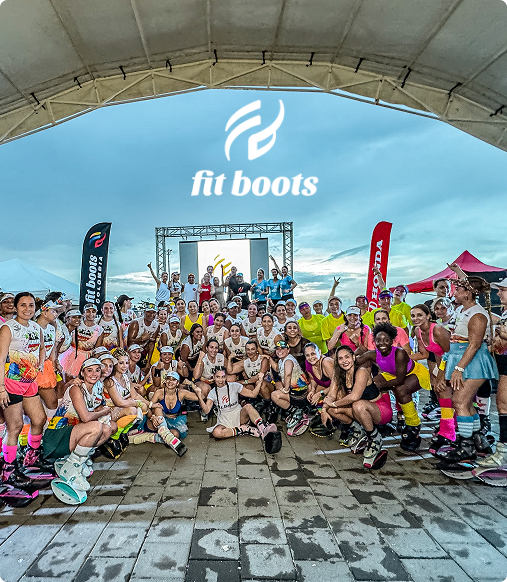 Group of people posing for a photo in front of a 'fit boots' banner.