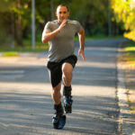 Man running while wearing Fit Boots Rebound Boots.